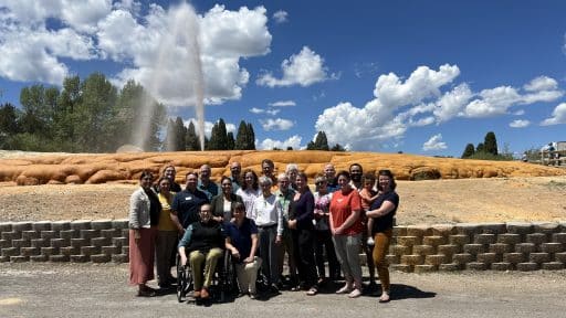 IHC Board and Staff Pictured in Front of Soda Springs Geyser